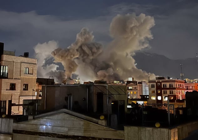 Plumes of smoke rise following reported explosions allegedly near Iran's Ministry of Intelligence on Araqi Street in Tehran on March 1, 2026.