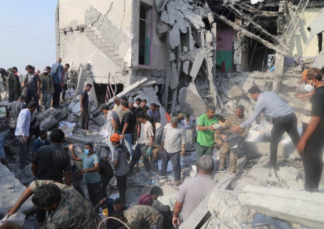 FILE PHOTO: People and rescue forces work following an Israel strike on a school in Minab, Iran, February 28, 2026.