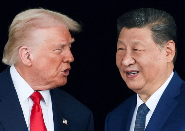 US President Donald Trump and Chinese President Xi Jinping talk as they leave after a bilateral meeting at Gimhae International Airport, on the sidelines of the Asia-Pacific Economic Cooperation (APEC) summit, in Busan, South Korea, October 30, 2025.
