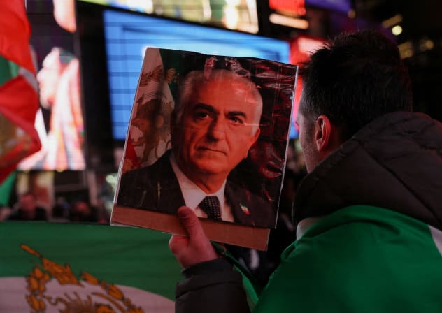 A demonstrator displays a portrait of Reza Pahlavi, the exiled son of Iran's last shah, as people rally against Iran's ruling establishment, following US and Israel strikes on Iran, in New York City, US, March 2, 2026.