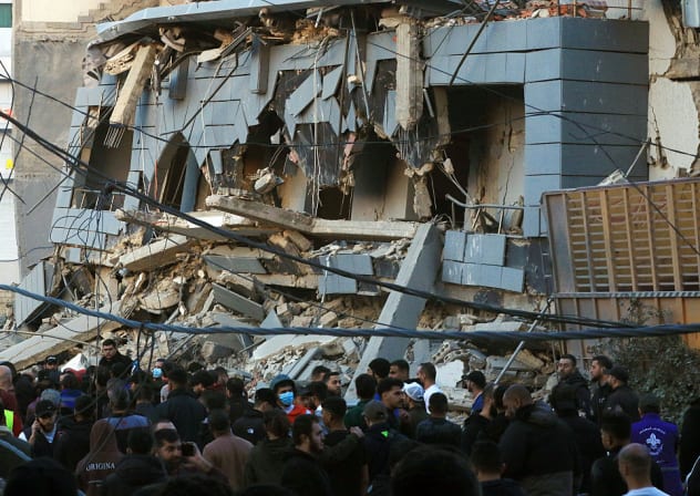 RESCUERS GATHER at the site of an Israeli airstrike that targeted the Jamaa Islamiya offices in the southern Lebanese coastal city of Sidon on March 3, 2026. 
