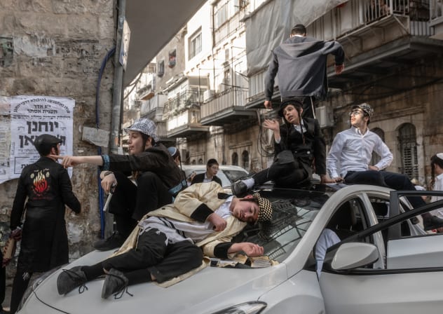 People celebrate Purim in Mea Shearim, Jerusalem.