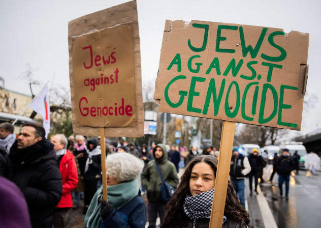 "Jews against genocide" is written on posters at a demonstration of several hundred people in Berlin, Dec. 23, 2023.