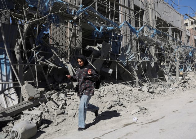Like the red heifer's ashes, the destruction of Iran's instruments of death can become the catalyst for cleansing. A woman walks on the street following an Israeli and U.S. strike on a police station, amid the U.S.-Israeli conflict with Iran, in Tehran, Iran, March 3, 2026.