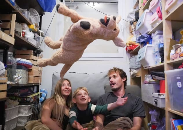 People take cover in their shelter as sirens warn of incoming missile fired from Iran, in central Israel, March 4. 2026. 
