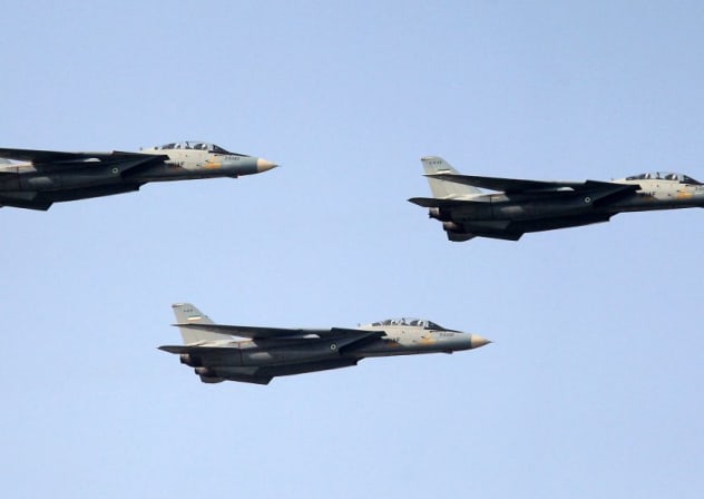 IRAN'S F-14 fighter jets fly during the annual Army Day military parade in Tehran on April 17, 2012.