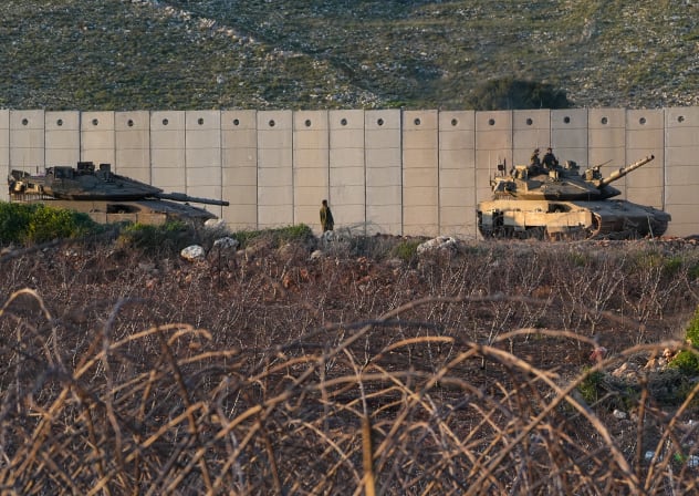 Israeli military vehicles and tanks are seen along the border with Lebanon, March 7, 2026