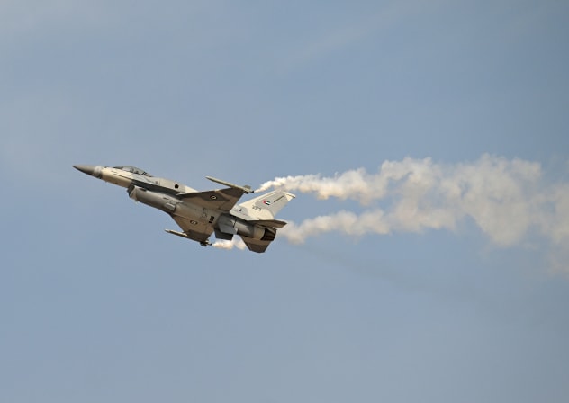 An Emirati Air Force F-16 performs a display flight at Al-Maktoum International Airport during the Dubai Airshow 2025 in Dubai, November 17, 2025