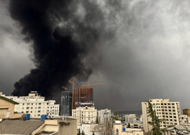 Smoke billows after airstrikes on oil depots on March 8, 2026 in Tehran, Iran. The United States and Israel continued their joint attack on Iran that began on February 28.