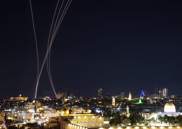Rocket trails from an interception by Israel's Iron Dome missile defence system are pictured over Jerusalem on March 1, 2026.