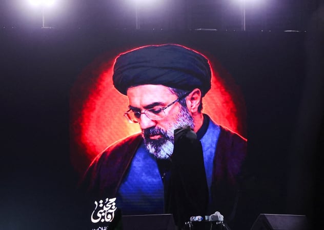 A picture of Iran's new supreme leader, Mojtaba Khamenei, is displayed on a screen in Tehran, Iran, March 9, 2026