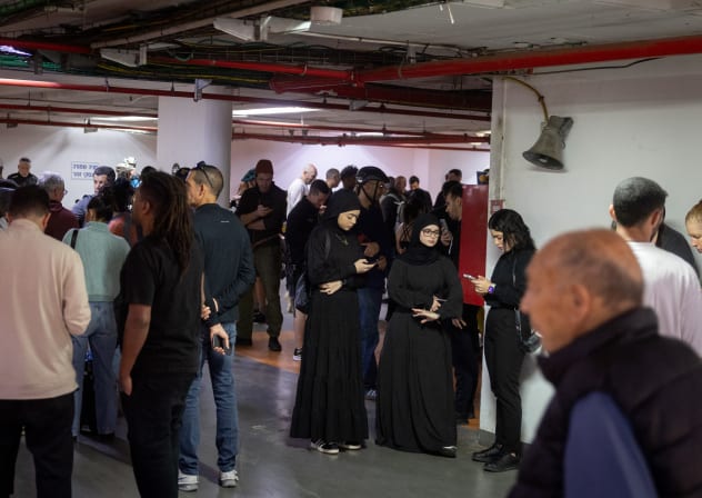  Israelis take cover in a public shelter as a siren is sounded warning of incoming missiles fired from Iran into Israel. March 06, 2026.