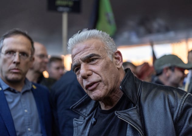Yair Lapid, leader of the opposition in the Israeli government joins a rally supporting the Israeli military draft and calling for ultra-Orthodox Jews to enlist for military service, in Jerusalem on January 15, 2026.