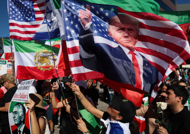 People hold signs in support of Reza Pahlavi, son of the last shah of Iran, along with a flag of US President Donald Trump as Iranian community members gather in support of regime change in Iran outside of the Westwood Federal Building in Los Angeles, California on March 7, 2026; illustrative.