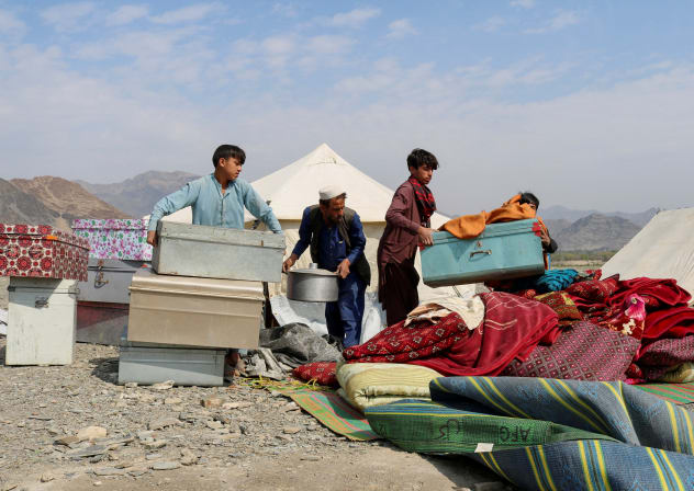 A displaced Afghan family who fled following exchanges of fire between Pakistani and Afghan forces at a border crossing arranges their belongings in a makeshift camp as they take refuge in Lal Pur district in eastern Nangarhar province, Afghanistan, March 4, 2026. 