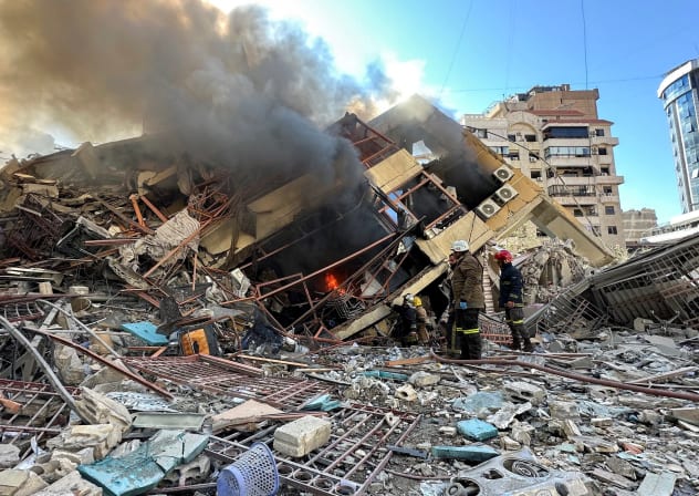 Members of the Lebanese Civil Defence inspect a damaged building after an Israeli strike on Beirut's southern suburbs, following renewed hostilities between Hezbollah and Israel amid the U.S.-Israeli conflict with Iran, Lebanon, March 9, 2026.