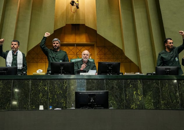 Iranian Parliament Speaker Mohammad Bagher Ghalibaf looks on as parliament members chant in support of the IRGC while wearing military uniforms in Tehran, Iran, February 1, 2026; illustrative.