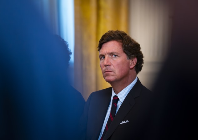 Tucker Carlson, former FOX News host and current host of The Tucker Carlson Show, attends a meeting with oil executives in the East Room of the White House on January 9, 2026 in Washington, DC.