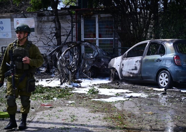 IDF soldier at the scene of a missile strike in central Israel, March 15, 2026.