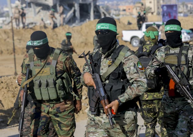 Hamas terrorists gather during a public event in Khan Younis, Gaza, on February 1, 2025. 