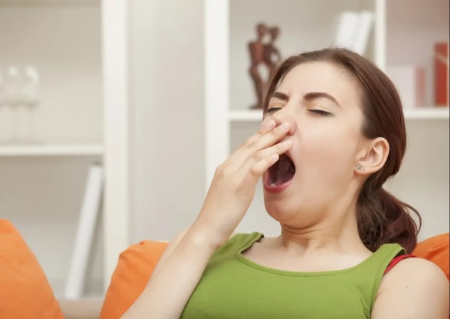 A woman yawning