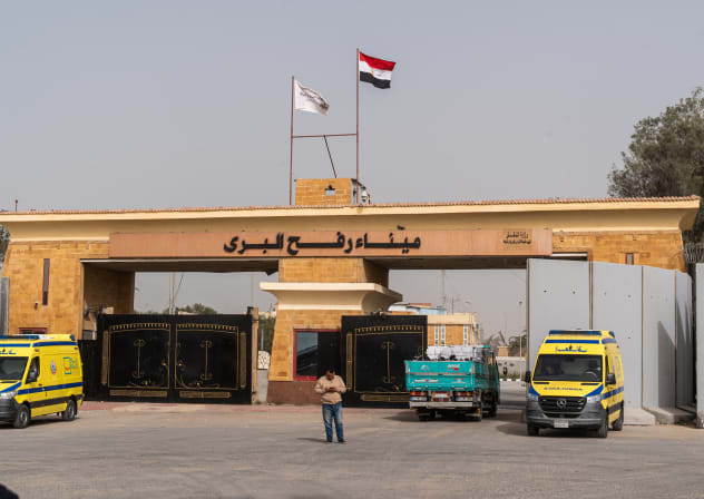 Ambulances stand at the border crossing on February 2, 2026 in Rafah, Egypt.