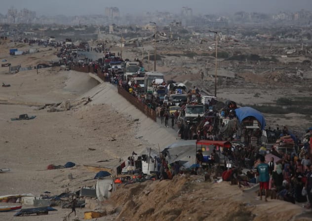 Palestinians flee with their belongings loaded on vehicles and carts as others walk along Rashid Street towards the south of Gaza, following intensified Israeli airstrikes and evacuation orders in the northern areas of the enclave in Gaza City, Gaza on September 17, 2025. 