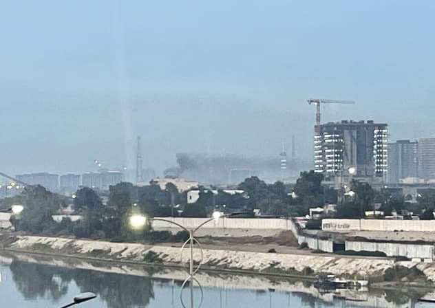 Smoke rises following a drone attack on the US embassy in Baghdad on March 14, 2026. A drone struck the US embassy in Baghdad on March 14, an Iraqi security official said, as an AFP journalist saw smoke rising from the complex.