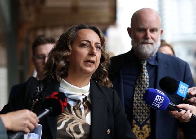Leonie Gittani, instructing solicitor for alleged Bondi Beach gunman Naveed Akram, speaks to the media as she leaves Downing Centre Local and District Court with Senior Public Defender for New South Wales Richard Wilson SC, in Sydney, Australia, March 17, 2026.