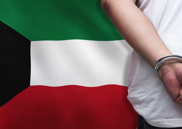 An illustration of a man in handcuffs with a Kuwaiti flag in the background.