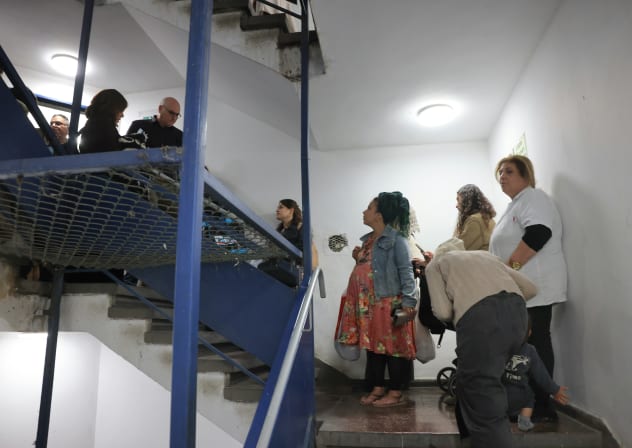 Israelis descend a stairwell towards a "protected space" in Jerusalem amid Israel's war with Iran, March 17, 2026.