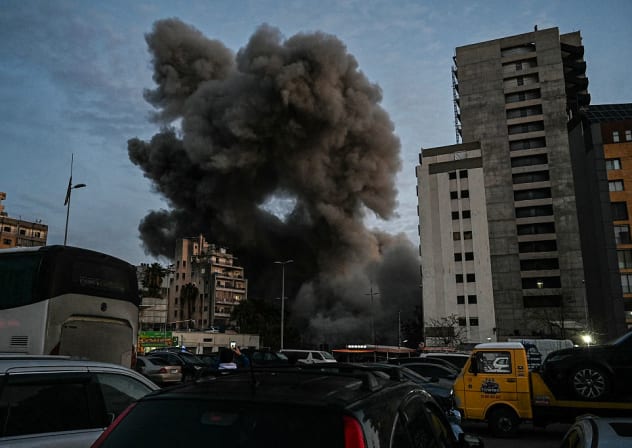 SMOKE ENGULFS a building hit by an Israeli airstrike in Beirut's Bashoura neighbourhood early on March 18, 2026.