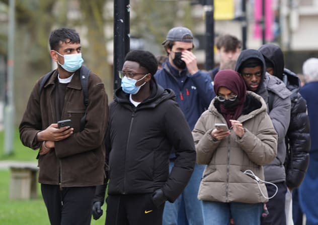 Students queuing for antibiotics outside a building at the University of Kent in Canterbury. Three schools have confirmed cases of meningitis after an outbreak killed two students and others were admitted to hospital on March 17, 2026. 