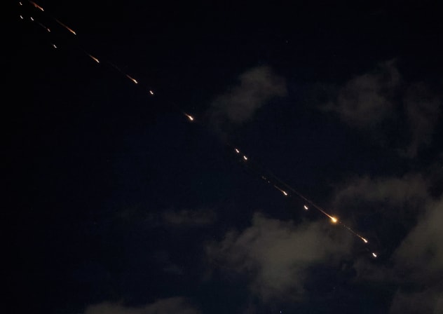 Rocket trails are seen in the sky above the Israeli center coastal city of Netanya amid a fresh barrage of Iranian missile attacks on March 9, 2026. 