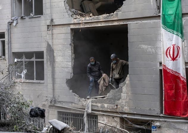  People clear rubble in a house in the Beryanak District after it was damaged by missile attacks two days before, on March 15, 2026 in Tehran, Iran. 