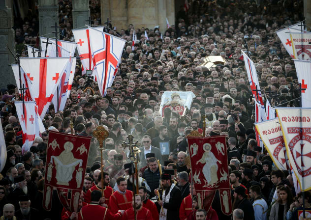 People pay their last respects to Georgia's late Patriarch Ilia II as his remains are carried to the Holy Trinity Cathedral in Tbilisi, Georgia March 18, 2026.