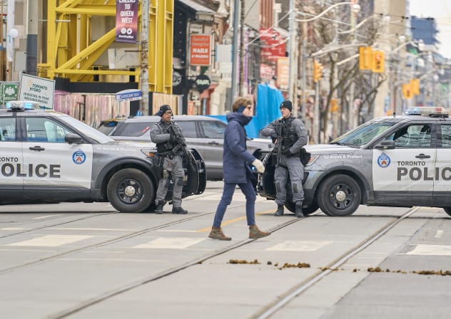 Toronto police stand watch near the Al-Quds day protest in Toronto, Ontario, on March 14, 2026.