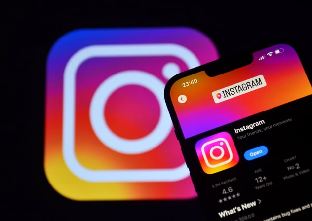 Illustrative image of an Instagram logo appearing on a smartphone screen.