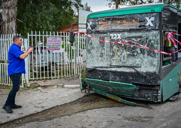 Israeli security and rescue forces at the scene where a missile fired from Lebanon toward Israel caused damage in the northern Israeli city of Kiryat Shmona, March 23, 2026.