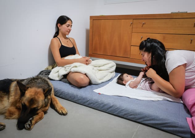 An Israeli family seen in their safe room in central Israel is atttacked by ballistic missiles fired from Iran. June 23, 2025.