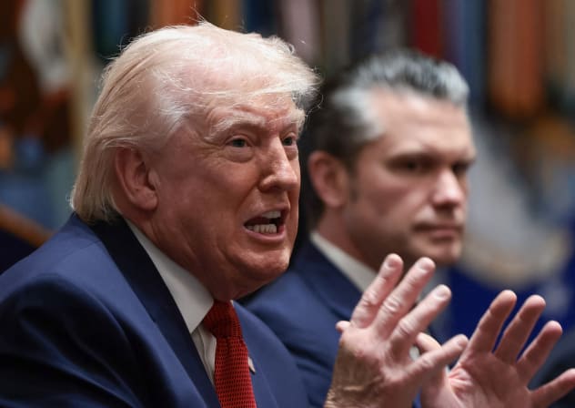 US President Donald Trump speaks next to Defense Secretary Pete Hegseth during a cabinet meeting at the White House in Washington, DC, US, March 26, 2026.