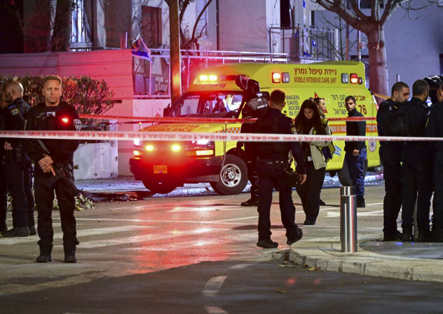 Israeli security and rescue forces at the scene where a missile fired from Iran toward Israel killed one person in Tel Aviv, March 27, 2026. 