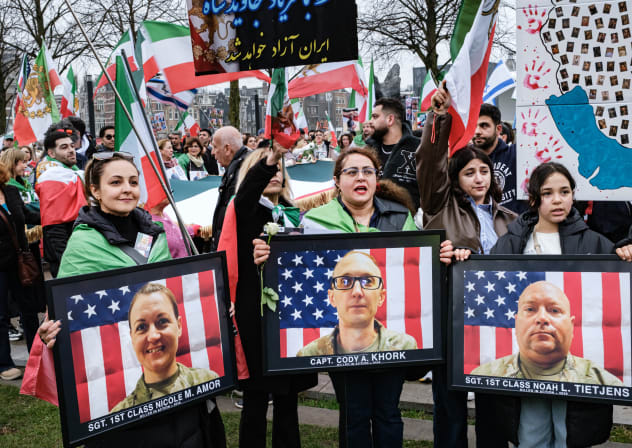 People hold portraits of three US soldiers killed in an Iranian drone attack in Kuwait during a march for Iran in Amsterdam, earlier this month. The erosion of America’s image in the Middle East did not occur overnight, the writer notes. 