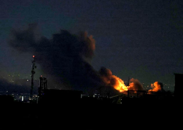 A PLUME of smoke rises from the site of a strike in Tehran on March 29, 2026.