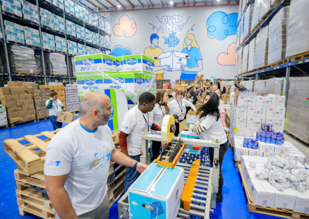 Latet volunteers are seen packing food for Passover.
