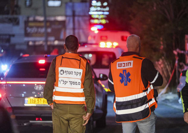 Israeli security and rescue forces operate at the scene where several people were lightly injured by a missile fired from Lebanon in Bi’ina, northern Israel, April 2, 2026.