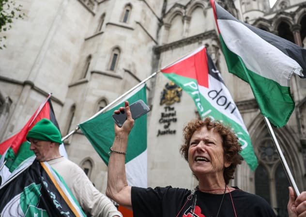 People gather outside London's High Court in London, Britain, July 30, 2025.