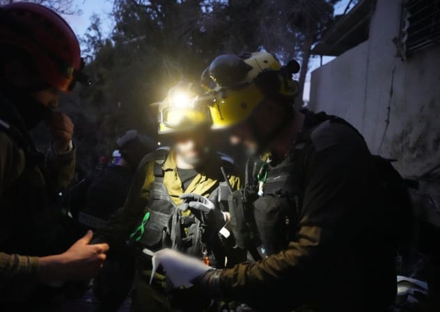 IDF rescue services seen at the scene of an impact site in Haifa, April 6, 2026.