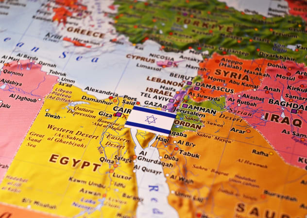 An illustrative image of an Israeli flag on top of a map of the Levant region of the Middle East.