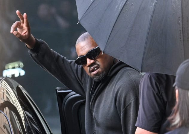 US rapper and producer Kanye West gestures upon arriving at Shanghai Pudong International Airport on July 11, 2025.